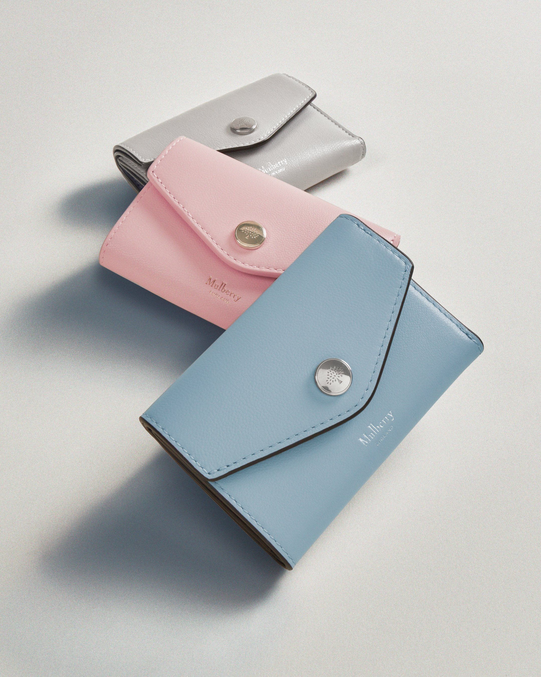 Three Mulberry wallets in blue, pink and grey